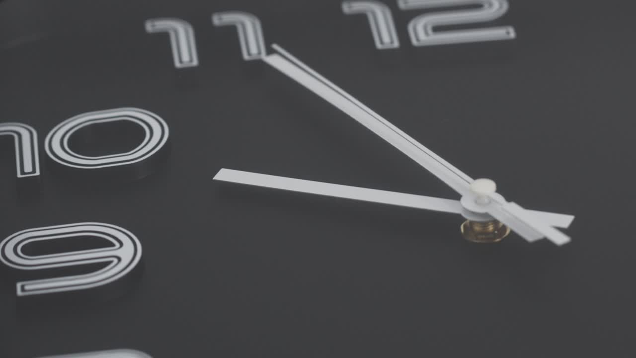 Black wall watch Showtime 9 o'clock.