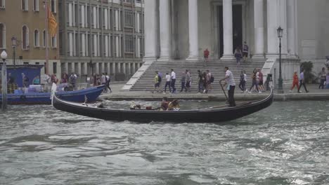 gondola sailing on the santa lucia canal in venice