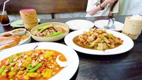 diverse thai dishes shared among friends