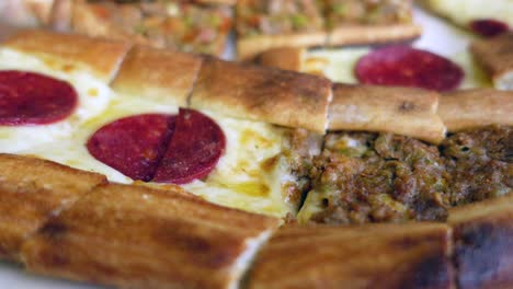 turkish pizza (pide) with cheese and sausage