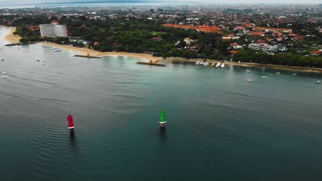 Beautiful-cinematic-Sanur-beach,-Bali-drone-footage-with-interesting-landscape,-fishing-boats,-hotel,-resorts-and-calm-weather