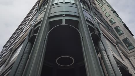 close view from the ground of modern building entrance in the city centre of london capital england uk