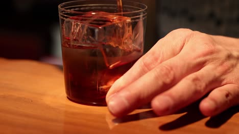 sequence of a bartender stirring a drink
