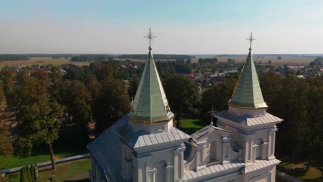 drone shot of church of st. michael the archangel towers with crosses in sirvintos, lithuania on a sunny day