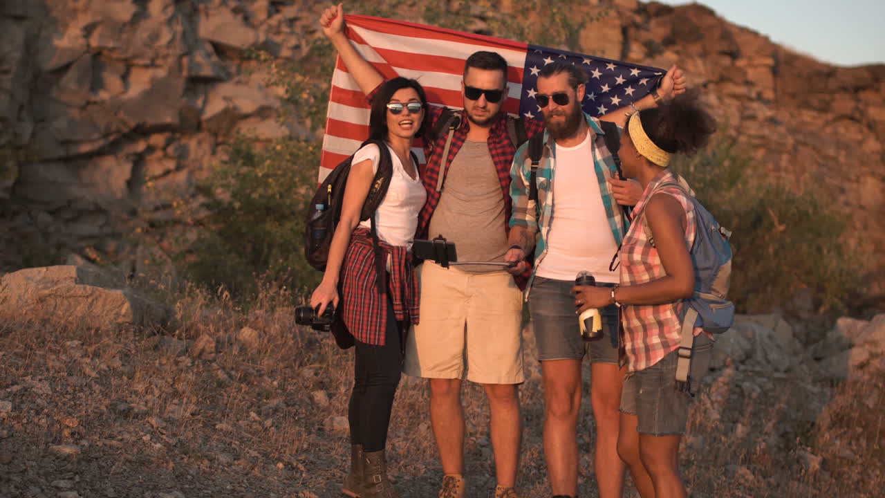 Friends Taking a Selfie with American Flag on a Hike