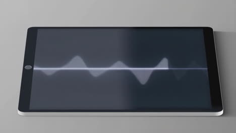 digital tablet with audio waveform on screen