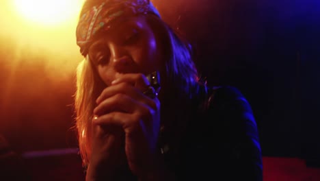 Woman-playing-harmonica-at-nightclub-4k