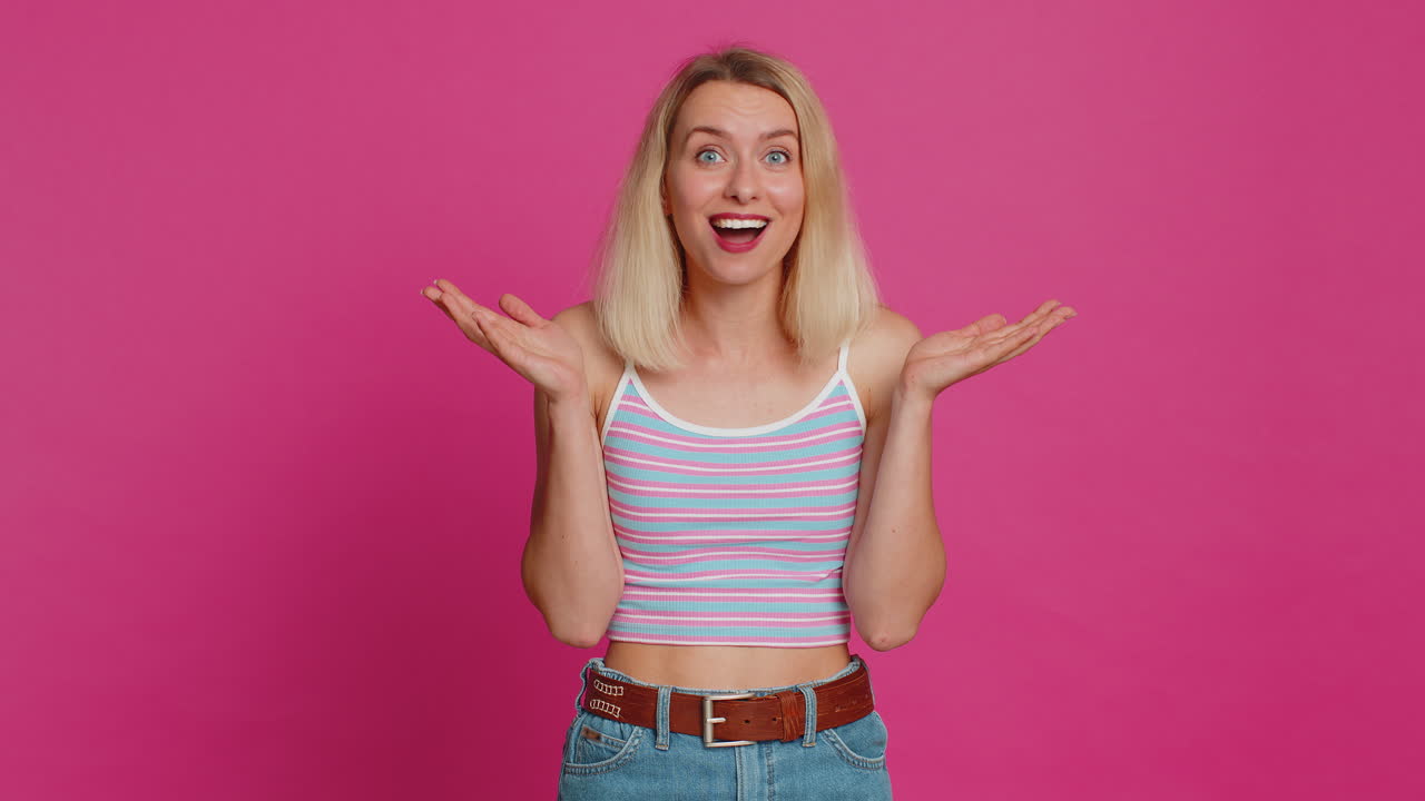 Shocked amazed woman surprise looking at camera with big eyes shocked by sudden victory wow emotion