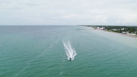 a couple approaching by jet ski