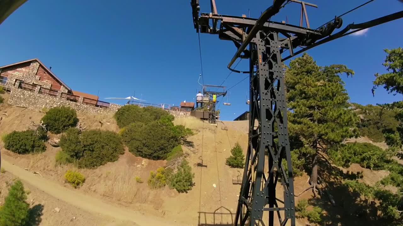 Riding ski lift to the top of mountain