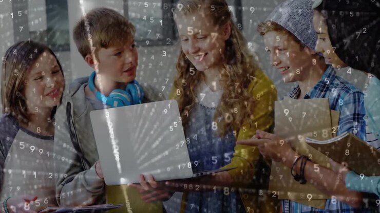 Five kids looking at laptop computer while numbers move
