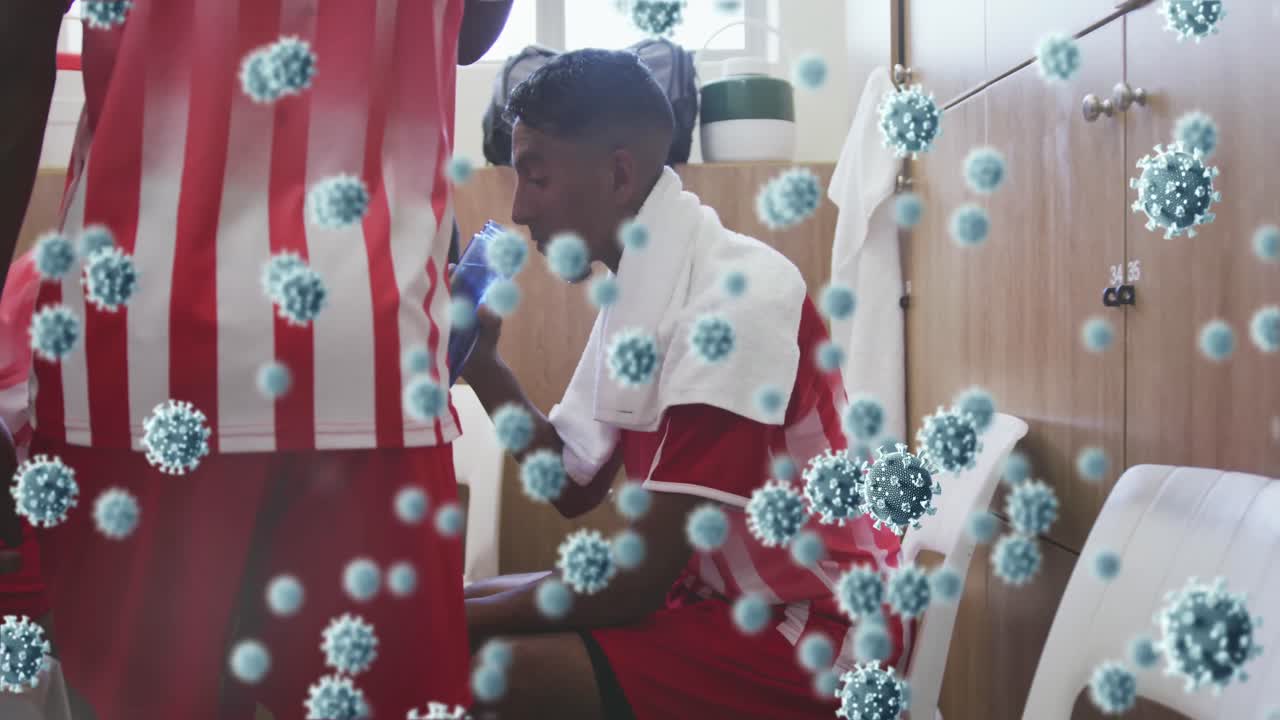 변기실에 있는 축구 선수들에 대한 코로나 19 세포의 애니메이션