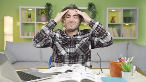 young man with headache suffering from aches and pains.