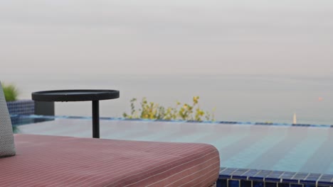 detailed shot of cushions placed on rooftop pool sun lounger