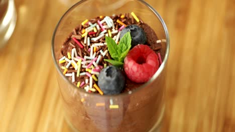 close up of garnished chocolate mousse  with berries