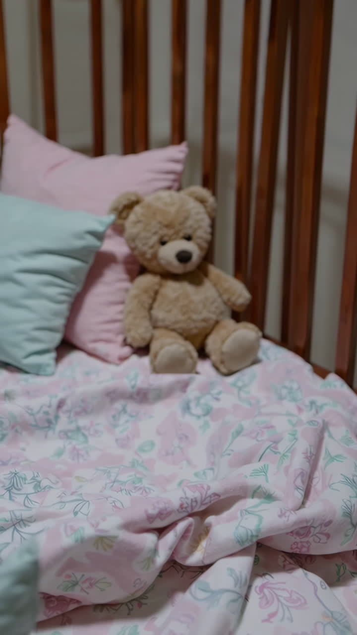 Baby Crib with Teddy Bear and Floral Bedding