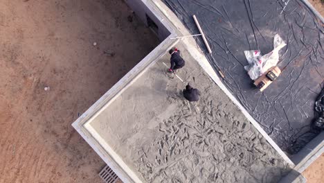 Flattening-cement-on-roof,-ICF-Block-house