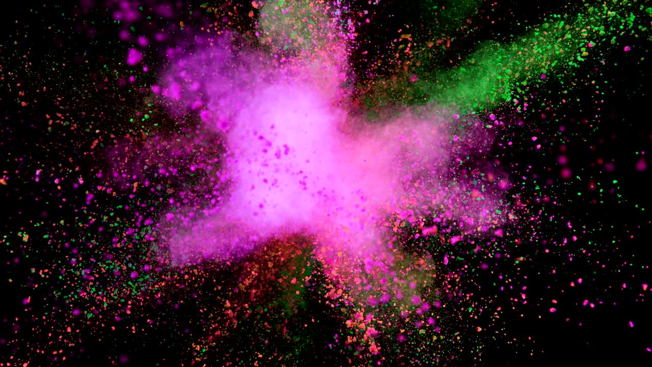 Explosión de polvo de colores sobre fondo negro
