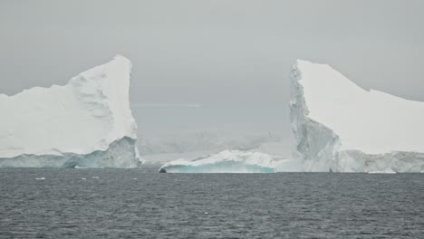 stunning big iceberg breaks in two pieces