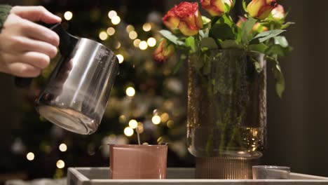 pouring melted paraffin into home candle, cozy background