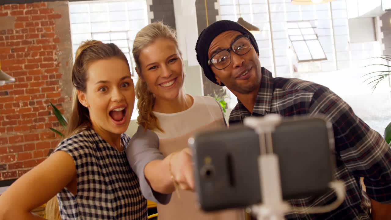 Executives taking selfie with mobile phone 4k