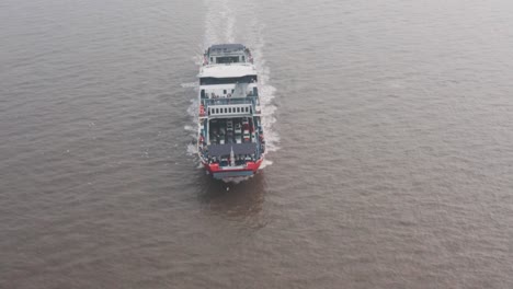 Car-ferry-drone-shot-pan-down-overhead