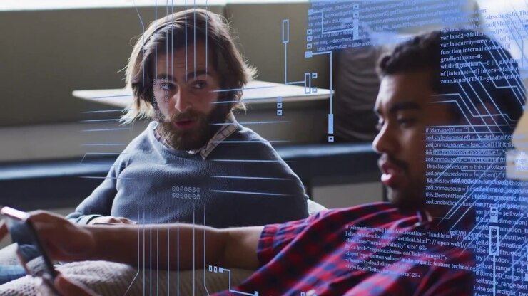 Man on right extending phone toward man on left, causing animated tech graphics and tablet tapping