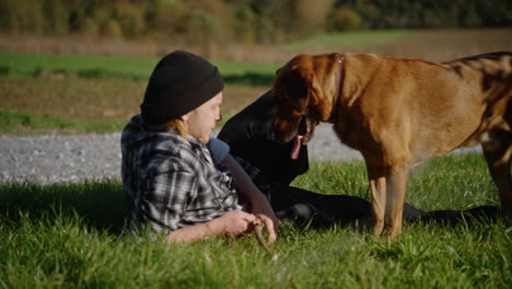 orbit around man playing fetch as he lays down relaxing with dog on cool autumn day