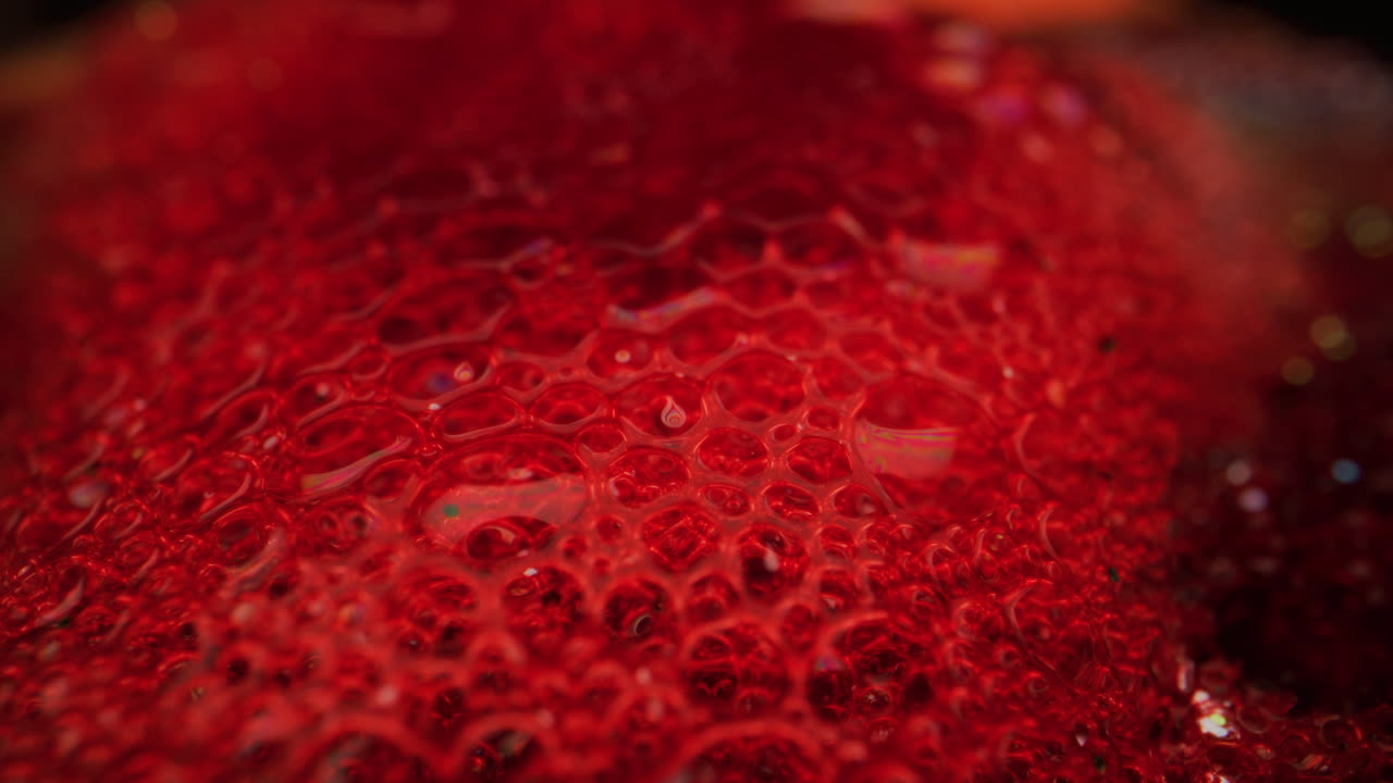 Close-up view of a red liquid texture