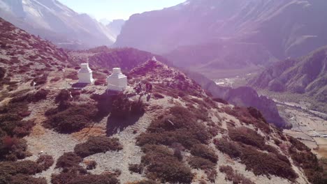 small temple at the patched hills overlooking the mountain range within annapurna circuit in nepal