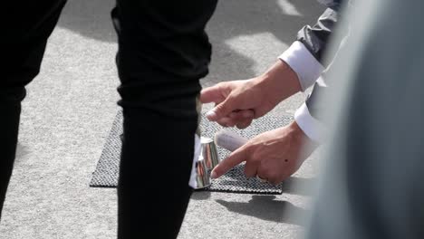 Closeup-of-street-gambling-on-follow-the-ball-trick-at-Westminster-bridge