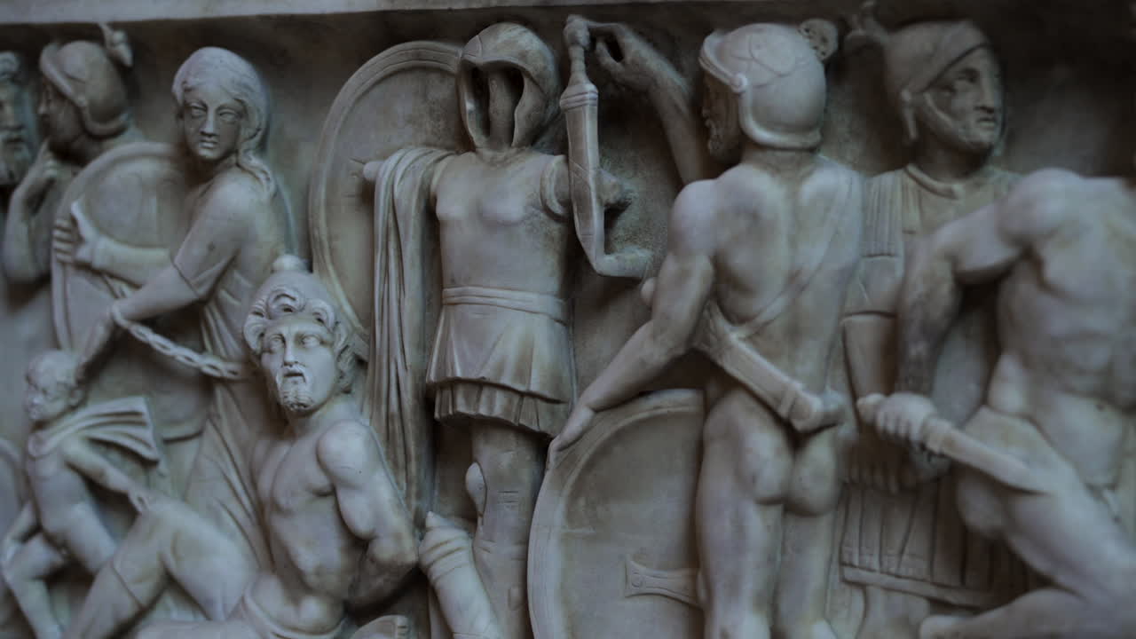 Ancient Roman marble carved sarcophagus depicting battle scene of Roman victorious military, prisoners and the vanquished.