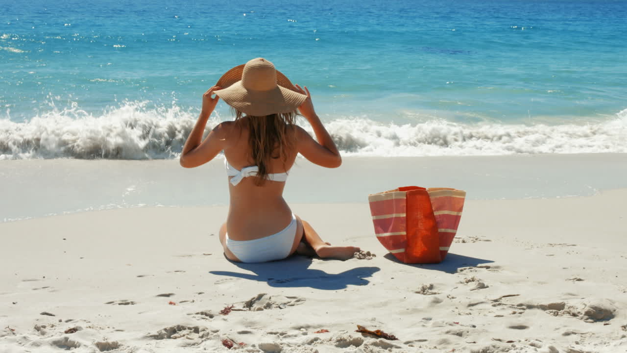 Beautiful woman relaxing at beach
