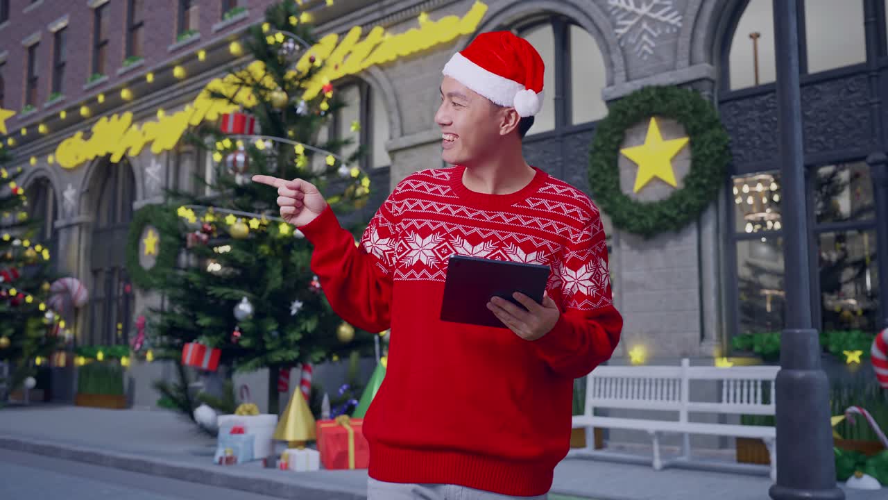 hombre en un suéter de navidad con tableta