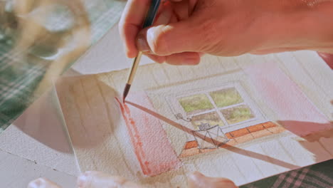 artist gently applying detail to a water colour painting, painter at work, close up shot, creativity