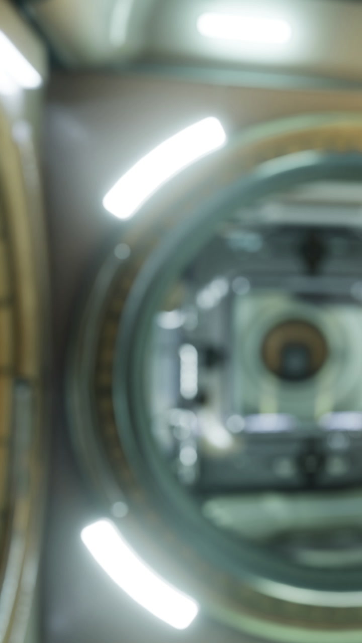 Camera view inside a lens housing with light reflections and details