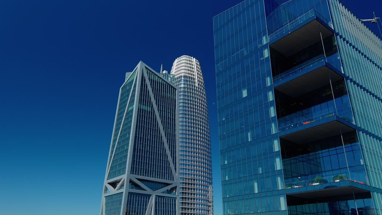 Imposing Salesforce tower, drone shot revealing vast cityscape