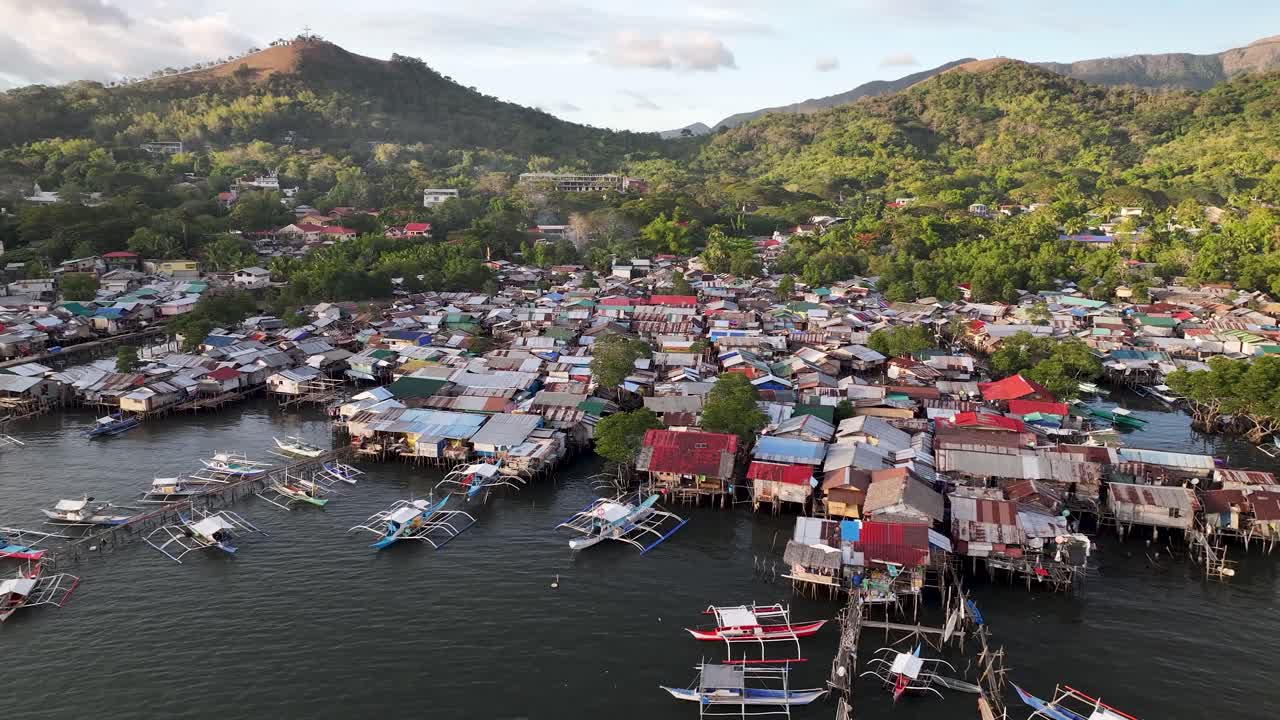 Coron slum, fishing village, drone birds eye view housing residential area, poor district. Philippines.