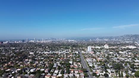 Aerial-push-in-drone-shot-over-Larchmont-neighborhood-during-early-morning