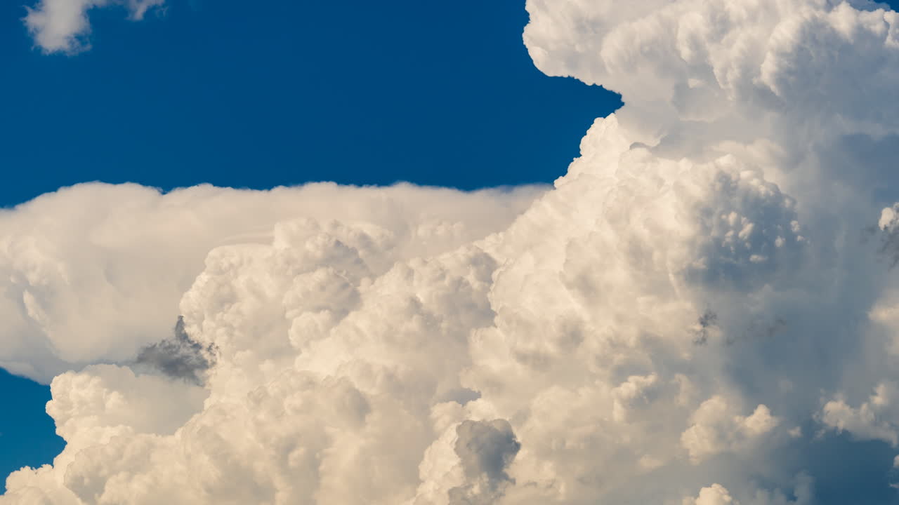 Epic cloud formations shifting across the sky showing dynamic weather building time lapse