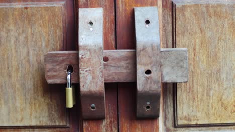 wooden latch locked progressively over time.