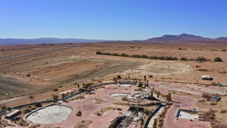 Aerial over vacant waterpark in Nevada desert