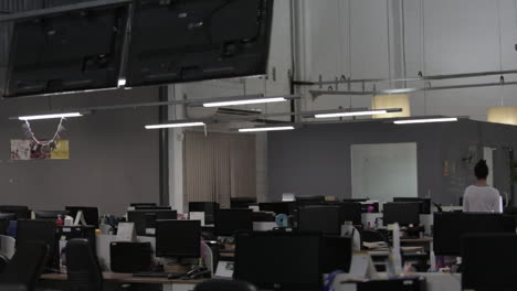 Young-woman-walks-alone-on-an-empty-office