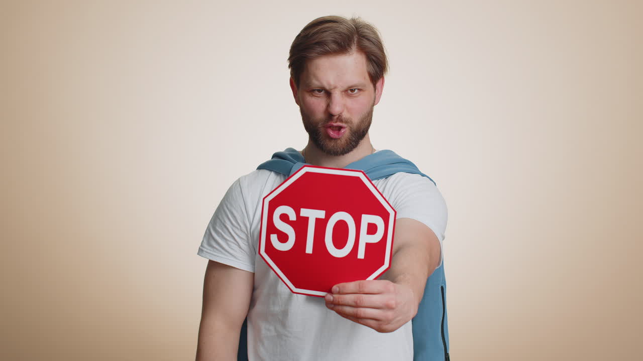 Angry man say no hold stop sign banner logo warning prohibited access danger crisis rejection
