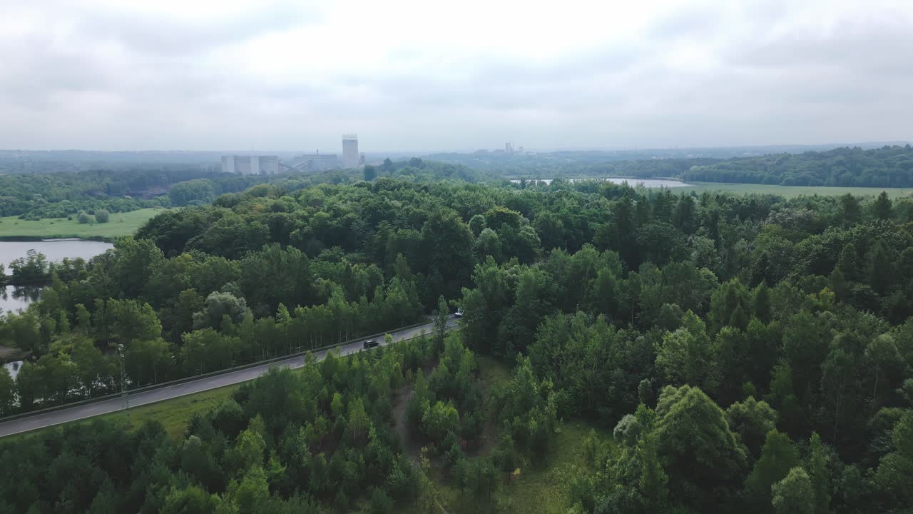 Green reclaimed forested landscape of post-coal mining region AERIAL