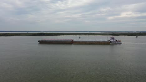 barcaza y bote de empuje en el río san jacinto