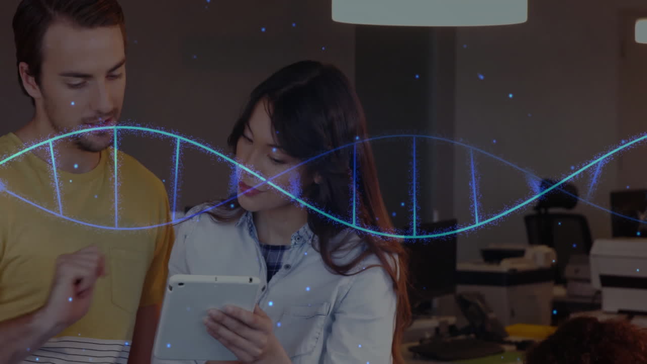 DNA strand animation over two people discussing with tablet in office