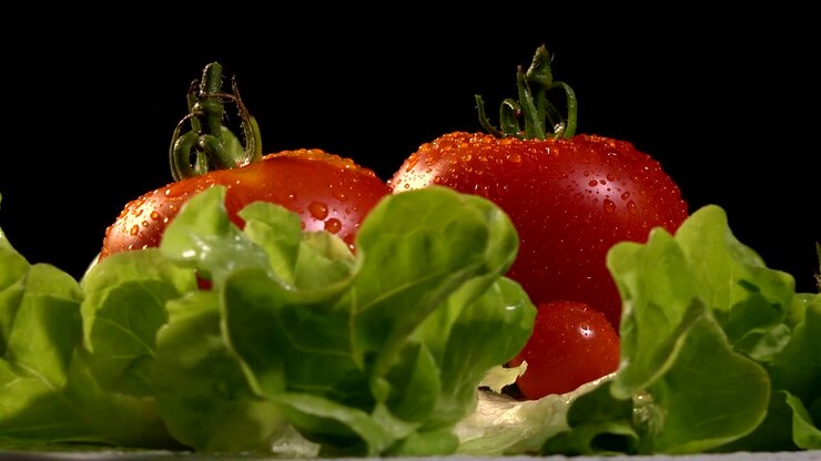 Tomatoes and Mozzarella on a lettuce leaf rotating, loop