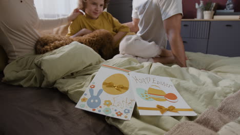 family celebrating easter in bed