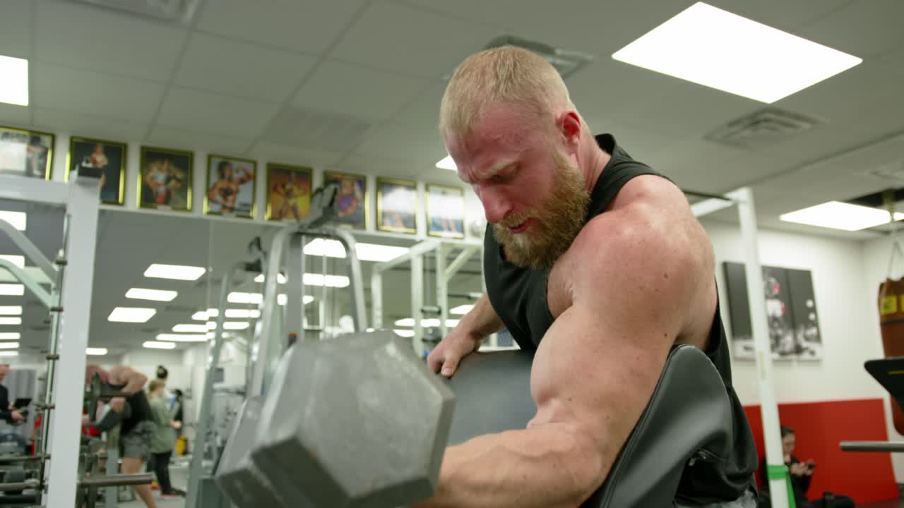 Powerful Man Exercising In Gym